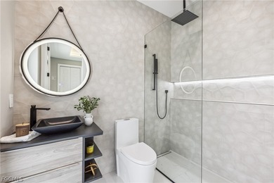 Welcome to a stunning new construction home perfectly positioned on Royal Tee Country Club in Florida - for sale on GolfHomes.com, golf home, golf lot