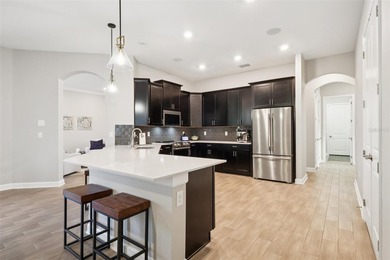 Perfectly positioned on a premium conservation homesite with on ChampionsGate Golf Resort in Florida - for sale on GolfHomes.com, golf home, golf lot