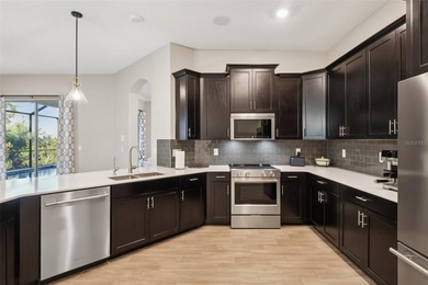 Perfectly positioned on a premium conservation homesite with on ChampionsGate Golf Resort in Florida - for sale on GolfHomes.com, golf home, golf lot