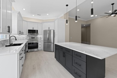 Stunning remodeled Oakmont in The Retreat with preserve views on Lost Lake Golf Club in Florida - for sale on GolfHomes.com, golf home, golf lot