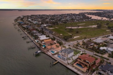 Experience the epitome of coastal elegance in this stunning on Key Royale Club in Florida - for sale on GolfHomes.com, golf home, golf lot