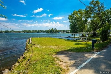 Build Your Dream Home!! On This Beautiful Peninsula Lake Front on Highland Hills Golf Course in Michigan - for sale on GolfHomes.com, golf home, golf lot