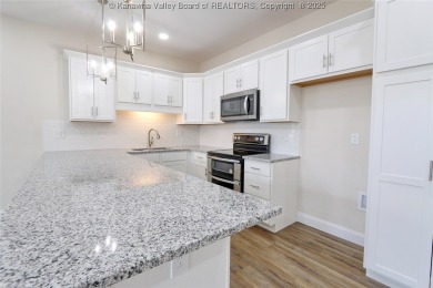 Stunning new construction home with a bright open layout with on Little Creek Country Club in West Virginia - for sale on GolfHomes.com, golf home, golf lot
