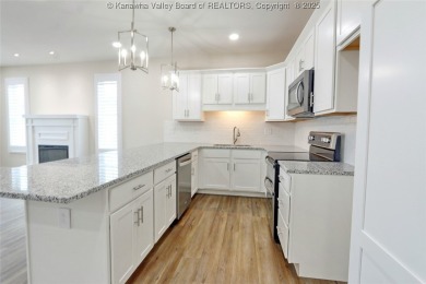 Stunning new construction home with a bright open layout with on Little Creek Country Club in West Virginia - for sale on GolfHomes.com, golf home, golf lot