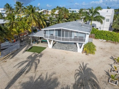 Welcome to this beautifully elevated 2-bedroom, 2-bathroom on  in Florida - for sale on GolfHomes.com, golf home, golf lot