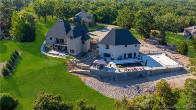 Welcome to a one-of-a-kind luxury estate in a gated Osage Beach on Sycamore Creek Golf Club in Missouri - for sale on GolfHomes.com, golf home, golf lot