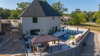 Welcome to a one-of-a-kind luxury estate in a gated Osage Beach on Sycamore Creek Golf Club in Missouri - for sale on GolfHomes.com, golf home, golf lot