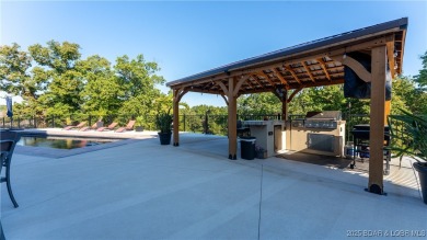 Welcome to a one-of-a-kind luxury estate in a gated Osage Beach on Sycamore Creek Golf Club in Missouri - for sale on GolfHomes.com, golf home, golf lot