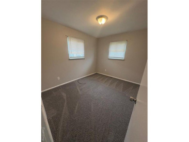 This charming and updated 2-bedroom, 1-bath ranch is move-in on The Links At Crystal Lake in Michigan - for sale on GolfHomes.com, golf home, golf lot