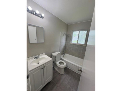 This charming and updated 2-bedroom, 1-bath ranch is move-in on The Links At Crystal Lake in Michigan - for sale on GolfHomes.com, golf home, golf lot
