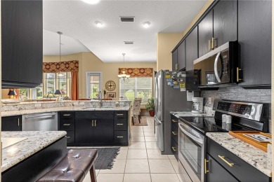 Nestled in the gated Harbor Hills community, this home offers a on Harbor Hills Country Club in Florida - for sale on GolfHomes.com, golf home, golf lot