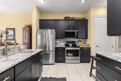 Nestled in the gated Harbor Hills community, this home offers a on Harbor Hills Country Club in Florida - for sale on GolfHomes.com, golf home, golf lot