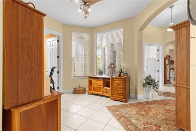 Nestled in the gated Harbor Hills community, this home offers a on Harbor Hills Country Club in Florida - for sale on GolfHomes.com, golf home, golf lot
