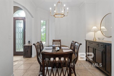 Discover coastal luxury in this former model home, meticulously on Peninsula Golf and Racquet Club in Alabama - for sale on GolfHomes.com, golf home, golf lot