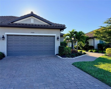 This beautifully appointed Ibis villa offers an exceptional on Esplanade Golf and Country at Lakewood Ranch in Florida - for sale on GolfHomes.com, golf home, golf lot
