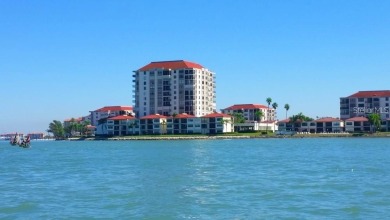Embrace the epitome of Coastal Living on the 8th floor of this on Isla Del Sol Yacht and Country Club in Florida - for sale on GolfHomes.com, golf home, golf lot