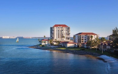 Embrace the epitome of Coastal Living on the 8th floor of this on Isla Del Sol Yacht and Country Club in Florida - for sale on GolfHomes.com, golf home, golf lot