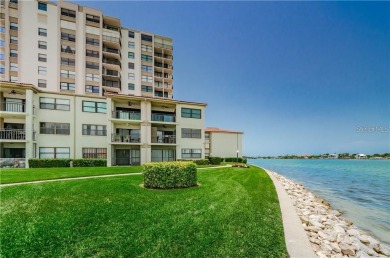 Embrace the epitome of Coastal Living on the 8th floor of this on Isla Del Sol Yacht and Country Club in Florida - for sale on GolfHomes.com, golf home, golf lot