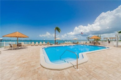 Embrace the epitome of Coastal Living on the 8th floor of this on Isla Del Sol Yacht and Country Club in Florida - for sale on GolfHomes.com, golf home, golf lot