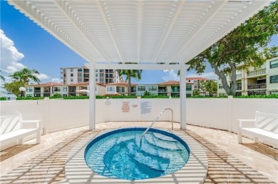 Embrace the epitome of Coastal Living on the 8th floor of this on Isla Del Sol Yacht and Country Club in Florida - for sale on GolfHomes.com, golf home, golf lot