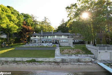 Welcome to 3211 Fleming Blvd. As you approach this magnificent on Big Bay Point Golf and Country Club in  - for sale on GolfHomes.com, golf home, golf lot