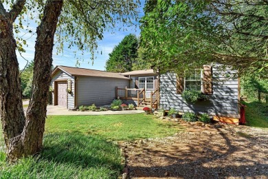 Relish the charm of this delightful home situated on the premier on The Trail At Chickasaw Pointe in South Carolina - for sale on GolfHomes.com, golf home, golf lot