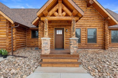 The stunning curb appeal doesn't end there as you enter through on The Golf Club At Devils Tower in Wyoming - for sale on GolfHomes.com, golf home, golf lot