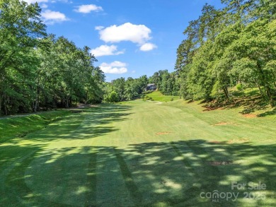 Immaculate golf course home overlooking the 16th fairway of on Rumbling Bald Resort on Lake Lure in North Carolina - for sale on GolfHomes.com, golf home, golf lot