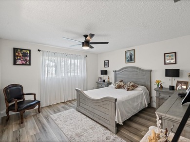 Beautifully remodeled 2-bedroom, 2-bathroom end-unit condominium on Seven Springs Golf and Country Club in Florida - for sale on GolfHomes.com, golf home, golf lot