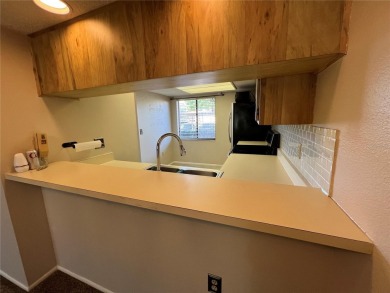 Welcome to this inviting first-floor, 2-bedroom, 2-bath condo in on East Lake Woodlands Country Club in Florida - for sale on GolfHomes.com, golf home, golf lot