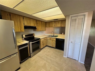 Welcome to this inviting first-floor, 2-bedroom, 2-bath condo in on East Lake Woodlands Country Club in Florida - for sale on GolfHomes.com, golf home, golf lot