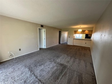 Welcome to this inviting first-floor, 2-bedroom, 2-bath condo in on East Lake Woodlands Country Club in Florida - for sale on GolfHomes.com, golf home, golf lot
