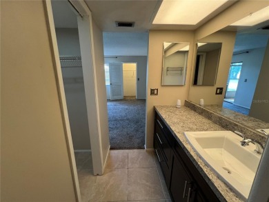 Welcome to this inviting first-floor, 2-bedroom, 2-bath condo in on East Lake Woodlands Country Club in Florida - for sale on GolfHomes.com, golf home, golf lot