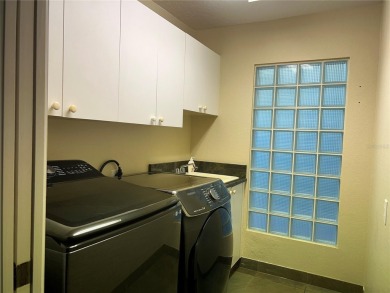 One or more photo(s) has been virtually staged. One or more on University Park Country Club in Florida - for sale on GolfHomes.com, golf home, golf lot