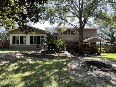 **Stunning Multilevel Home with Water Access & Golf Course on Sunkist Country Club, Inc. in Mississippi - for sale on GolfHomes.com, golf home, golf lot