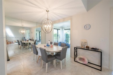 Beautifully upgraded end-unit townhome with stunning lake and on Boca Pointe Country Club in Florida - for sale on GolfHomes.com, golf home, golf lot