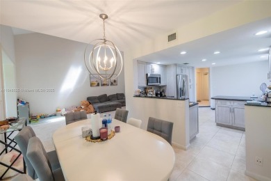 Beautifully upgraded end-unit townhome with stunning lake and on Boca Pointe Country Club in Florida - for sale on GolfHomes.com, golf home, golf lot