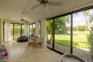 Beautifully upgraded end-unit townhome with stunning lake and on Boca Pointe Country Club in Florida - for sale on GolfHomes.com, golf home, golf lot