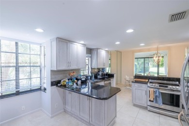 Beautifully upgraded end-unit townhome with stunning lake and on Boca Pointe Country Club in Florida - for sale on GolfHomes.com, golf home, golf lot