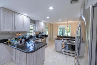 Beautifully upgraded end-unit townhome with stunning lake and on Boca Pointe Country Club in Florida - for sale on GolfHomes.com, golf home, golf lot