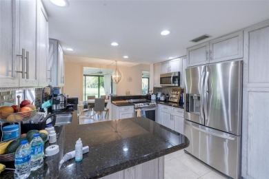 Beautifully upgraded end-unit townhome with stunning lake and on Boca Pointe Country Club in Florida - for sale on GolfHomes.com, golf home, golf lot