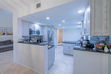 Beautifully upgraded end-unit townhome with stunning lake and on Boca Pointe Country Club in Florida - for sale on GolfHomes.com, golf home, golf lot