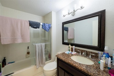 Beautifully upgraded end-unit townhome with stunning lake and on Boca Pointe Country Club in Florida - for sale on GolfHomes.com, golf home, golf lot