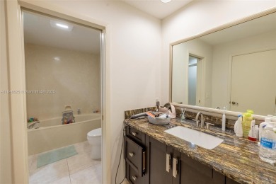 Beautifully upgraded end-unit townhome with stunning lake and on Boca Pointe Country Club in Florida - for sale on GolfHomes.com, golf home, golf lot