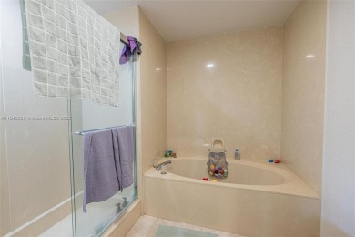Beautifully upgraded end-unit townhome with stunning lake and on Boca Pointe Country Club in Florida - for sale on GolfHomes.com, golf home, golf lot