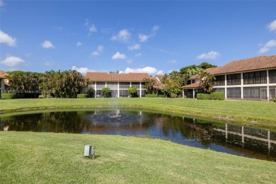 Beautifully upgraded end-unit townhome with stunning lake and on Boca Pointe Country Club in Florida - for sale on GolfHomes.com, golf home, golf lot