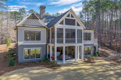 Experience luxury living in this stunning custom home, nestled on Reynolds Lake Oconee - The Landing in Georgia - for sale on GolfHomes.com, golf home, golf lot