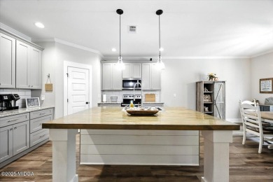 Welcome to this beautifully designed 5-bedroom, 4-bath home in on Canongate At Healy Point Country Club in Georgia - for sale on GolfHomes.com, golf home, golf lot