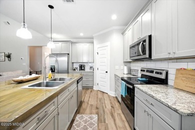 Welcome to this beautifully designed 5-bedroom, 4-bath home in on Canongate At Healy Point Country Club in Georgia - for sale on GolfHomes.com, golf home, golf lot
