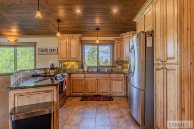 Modern Mountain Escape on the Golf Course! Experience mountain on Island Park Village Resort Golf Course in Idaho - for sale on GolfHomes.com, golf home, golf lot